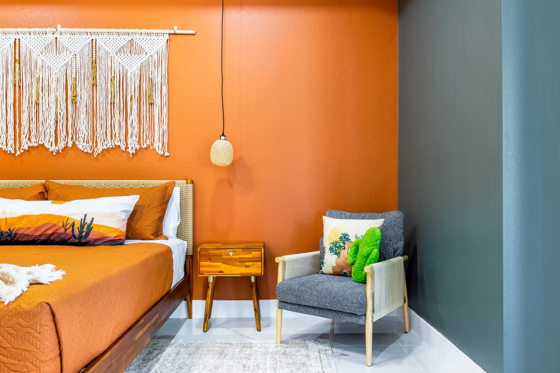 Bohemian bedroom with terracotta accent wall