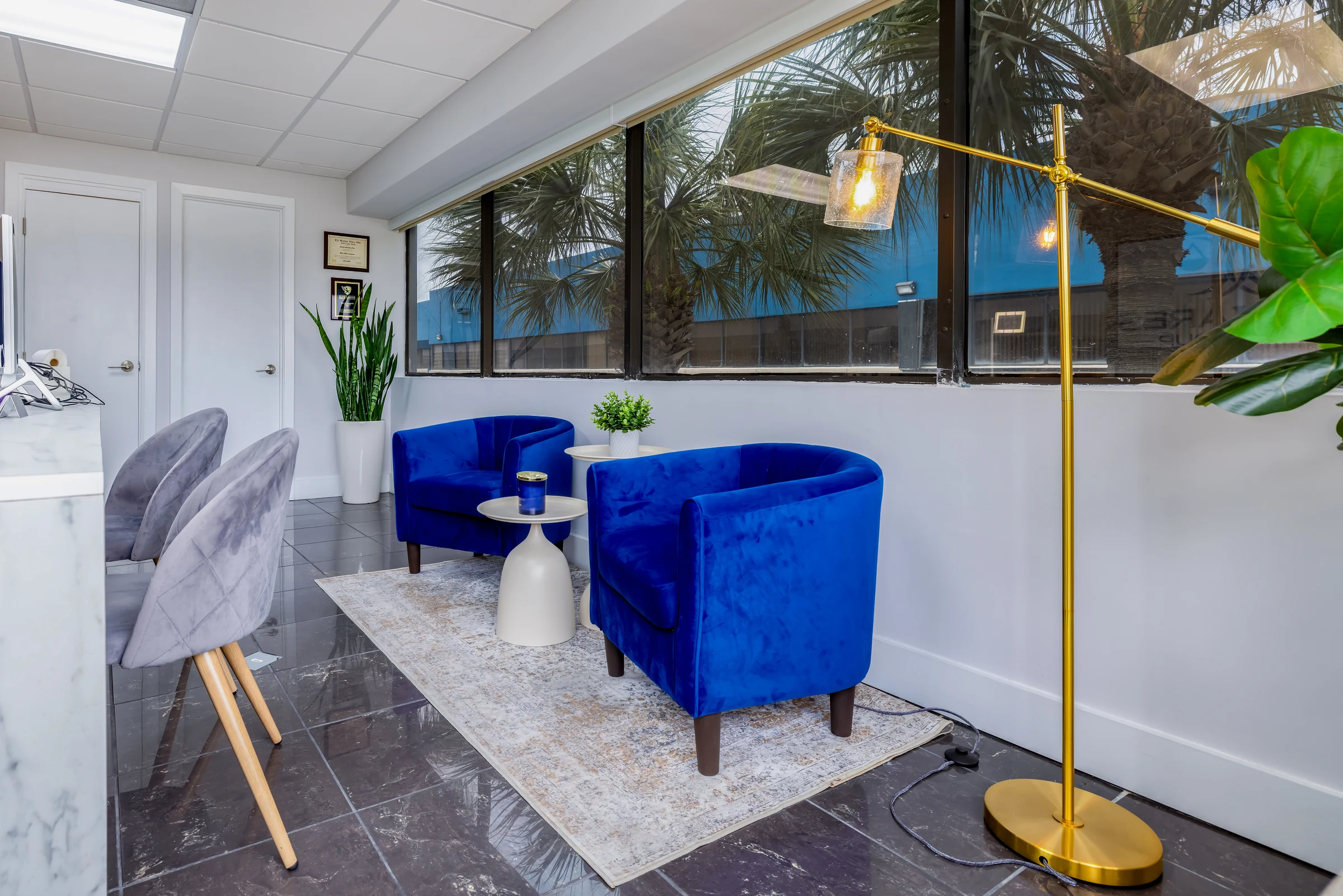 Cañizares Law Group — lounge with blue velvet accents