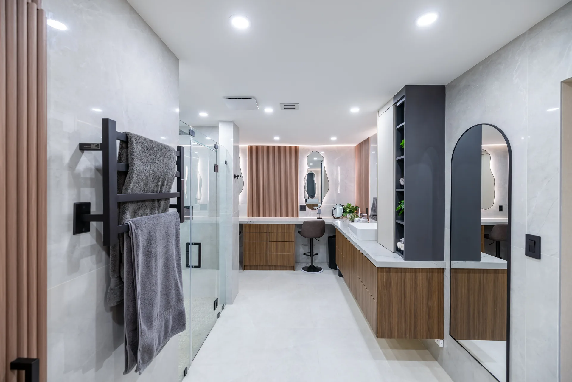 Master bathroom with organic mirrors and LED accents
